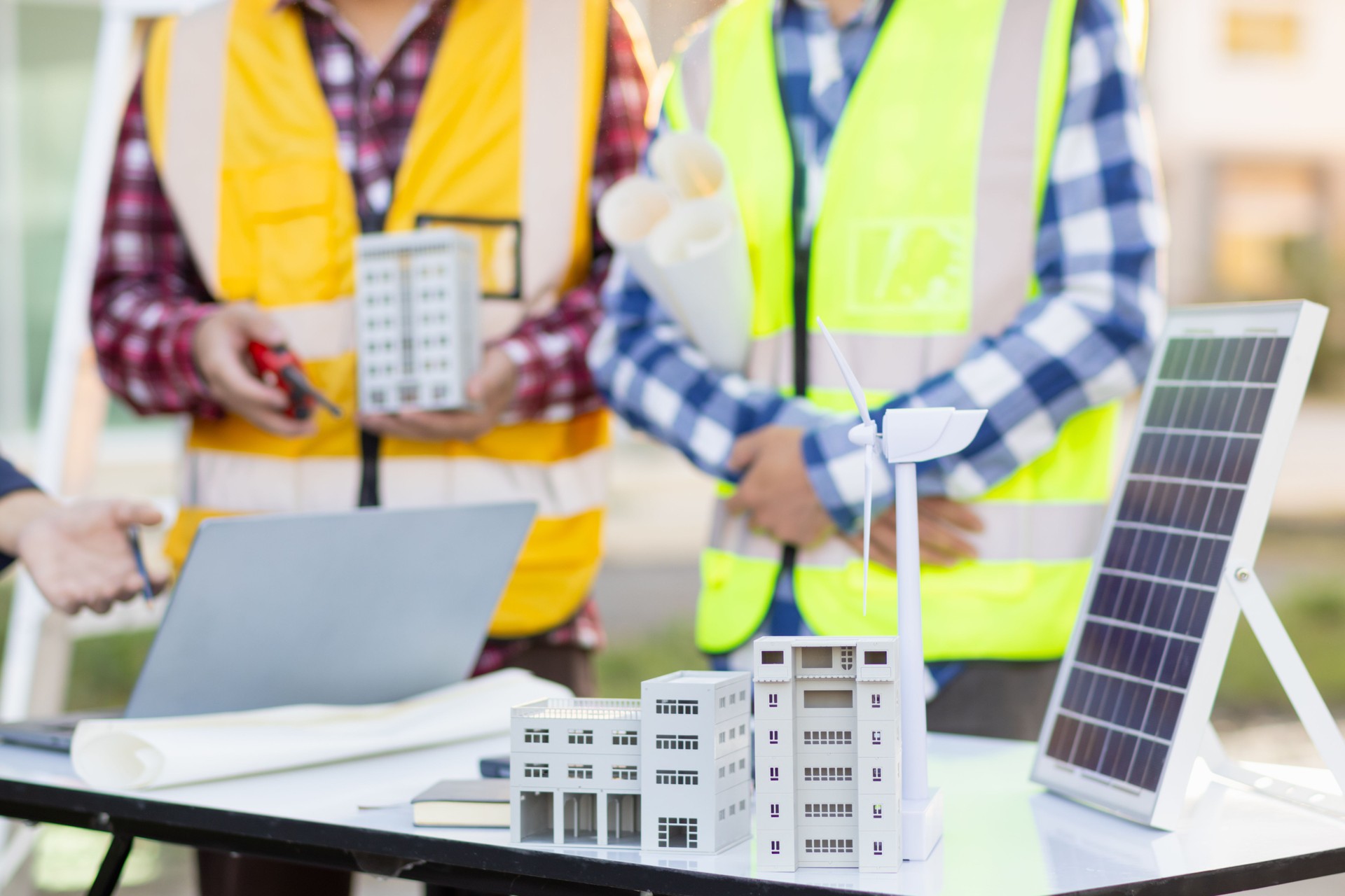 Engineers are reviewing plans from architects to prepare to install solar panels and wind turbines on the building to efficiently produce electricity using the concept of green energy from solar cells